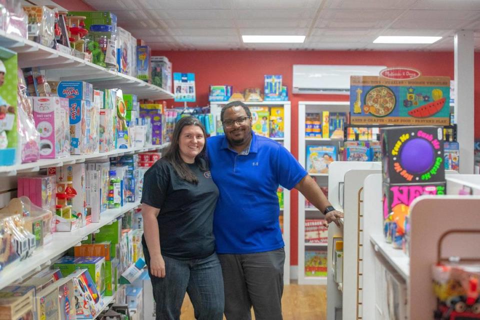Nikki and Joey Jones, owners of Ready Set Play, a toy store, pose for a portrait at their store in downtown Hazard, Ky., on Thursday, April 28, 2022.