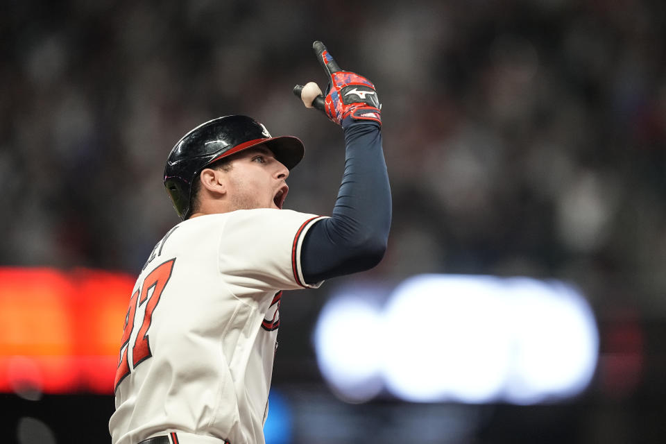 Atlanta Braves' Austin Riley (27) celebrates hitting a two run homer in the eighth inning of Game 2 of a baseball NL Division Series against the Philadelphia Phillies, Monday, Oct. 9, 2023, in Atlanta. (AP Photo/Brynn Anderson)