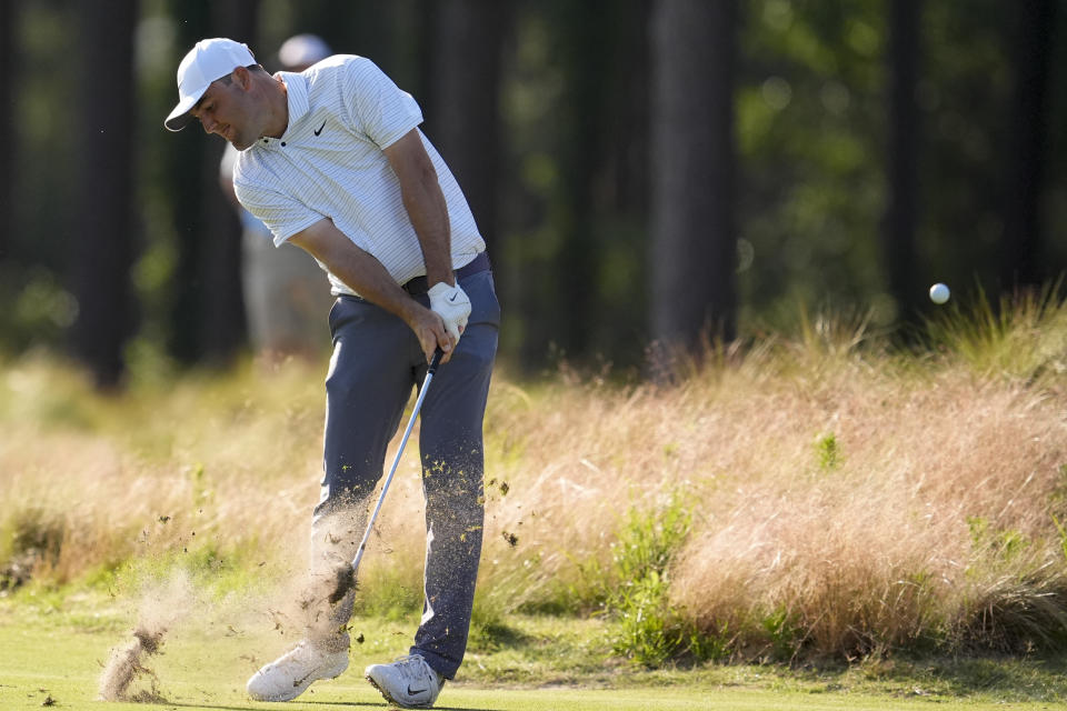 Scottie Scheffler hits from the fairway on the 11th hole during the second round of the U.S. Open golf tournament Friday, June 14, 2024, in Pinehurst, N.C. (AP Photo/George Walker IV)