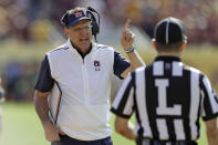 Auburn head coach Gus Malzahn question a touchdown by Minnesota with line judge Jim Slayton during the first half of the Outback Bowl NCAA college football game Wednesday, Jan. 1, 2020, in Tampa, Fla. (AP Photo/Chris O'Meara)