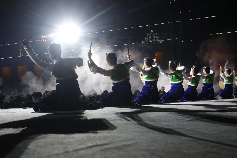 Performers entertain the gathered crowds during celebrations to mark the New Year, at Kim Il Sung Square in Pyongyang, North Korea, early Friday, Jan., 1, 2021. (AP Photo/Jon Chol Jin)