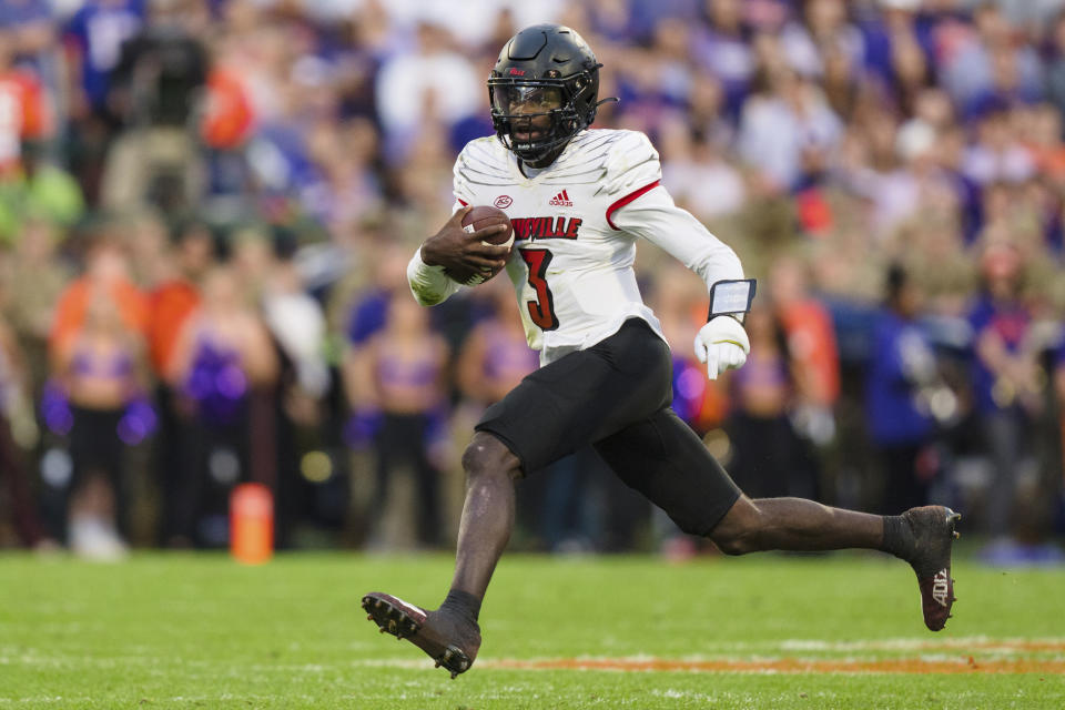 Louisville quarterback Malik Cunningham (3) runs with the ball in the first half of an NCAA college football game against Clemson, Saturday, Nov. 12, 2022, in Clemson, S.C. (AP Photo/Jacob Kupferman)