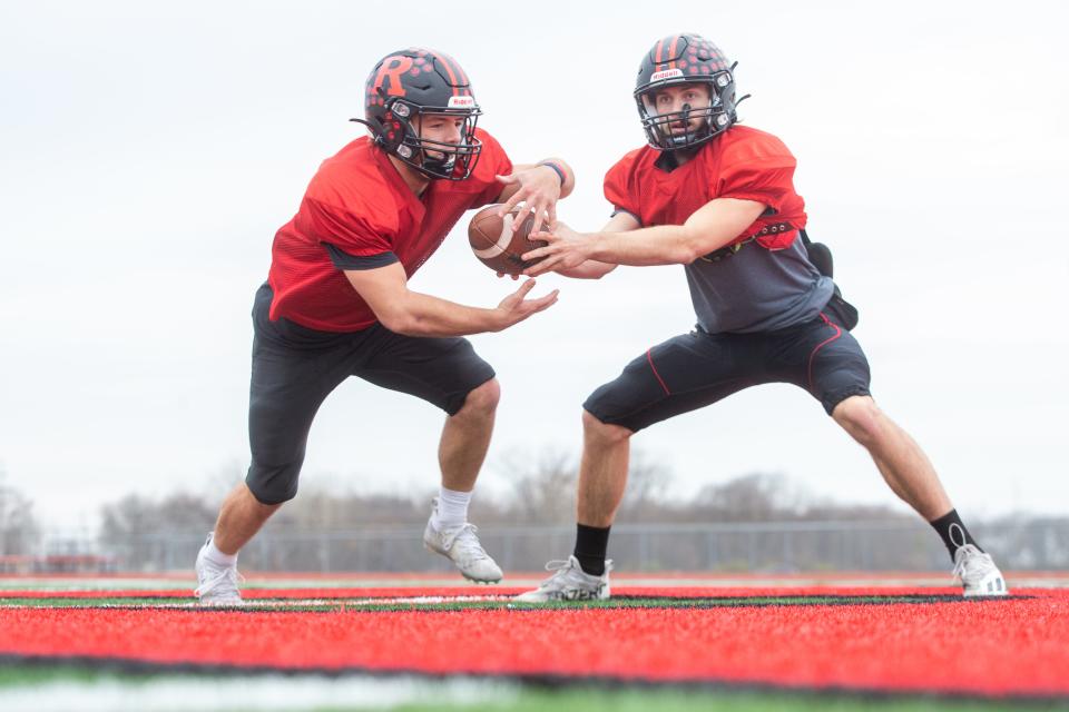 Practicing a handoff after practice last Wednesday, Rossville senior quarterback Torrey Horak places the ball into the hands of senior running back Corey Cantron like they've done hundreds of times before.