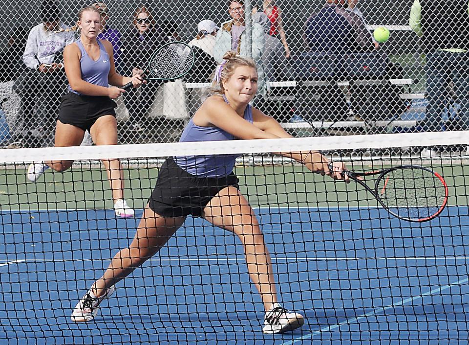 Watertown's Cayda Weiss reaches to hit the ball as teammate Karlie Schulte (left) looks on in a third-flight doubles match during the opening day of the state Class AA high school girls tennis tournament on Thursday, Oct. 5, 2023 at Sioux Falls.