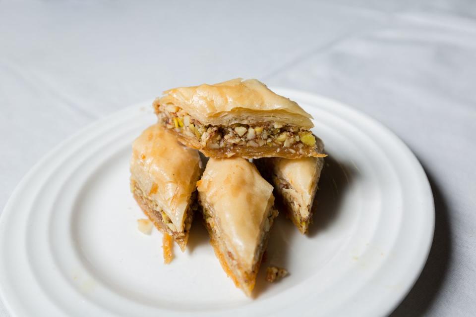eid alfitr food closeup of baklava, a dessert made with filo pastry and chopped nuts and sugar syrup