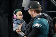 <p>Nick Foles #9 of the Philadelphia Eagles celebrates with his daughter Lily Foles after his 41-33 victory over the New England Patriots in Super Bowl LII at U.S. Bank Stadium on February 4, 2018 in Minneapolis, Minnesota. The Philadelphia Eagles defeated the New England Patriots 41-33. (Photo by Streeter Lecka/Getty Images) </p>