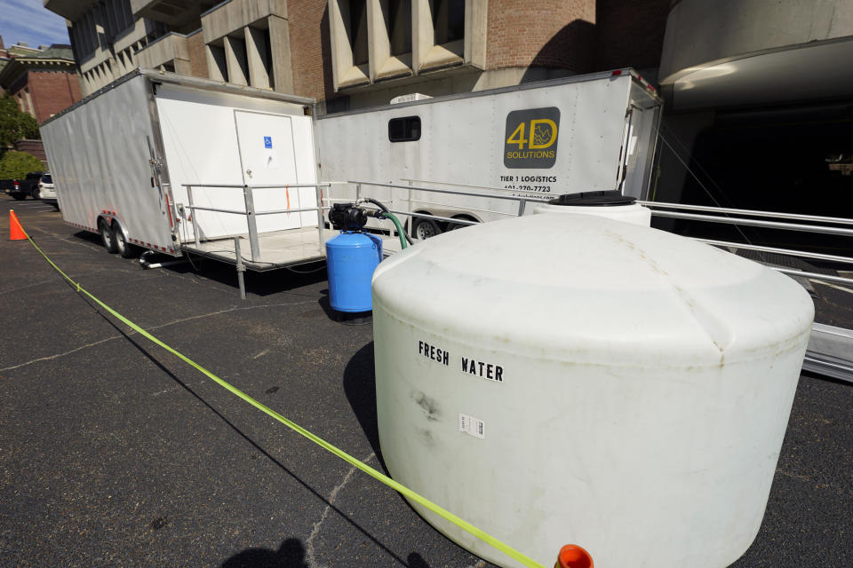 Two sets of portable showers are located on the Millsaps College campus to serve the remains 200 students that live in the dorms, in midtown Jackson, Miss., Thursday, Sept. 1, 2022. Erratic water pressure from the water lines in Jackson, are a problem made worse since the recent flooding of the Pearl River affected the city's main water treatment plant in Ridgeland. (AP Photo/Rogelio V. Solis)