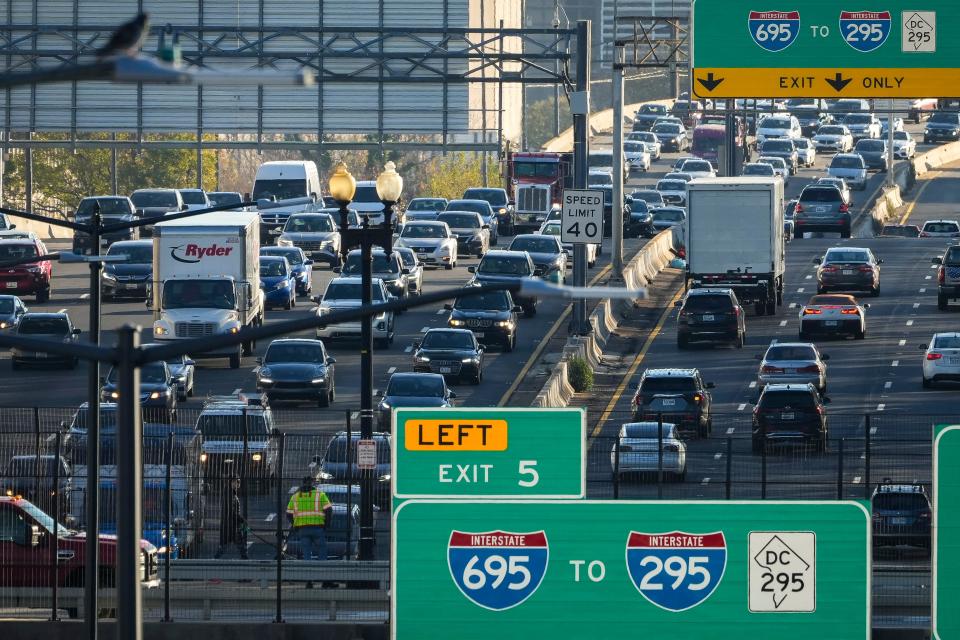 Heavy traffic moves along Interstate 395 on Tuesday morning November 22, 2022 in Washington, D.C.