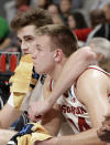 Wisconsin's Nate Reuvers, left, and Brad Davison sit on the bench during the second half of a first-round against Oregon in the NCAA men's college basketball tournament Friday, March 22, 2019, in San Jose, Calif. (AP Photo/Chris Carlson)