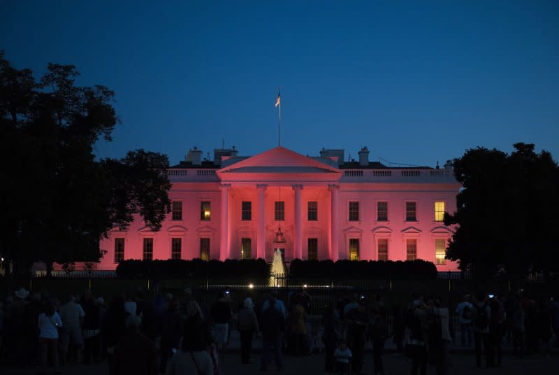 The White House is illuminated with pink light in honor of National Breast Cancer Awareness Month, in Washington, D.C., on October 1. On October 13, 1792, the cornerstone to the White House in Washington was laid. It would be November 1800 before the first presidential family -- that of John Adams -- moved in. Photo by Kevin Dietsch/UPI