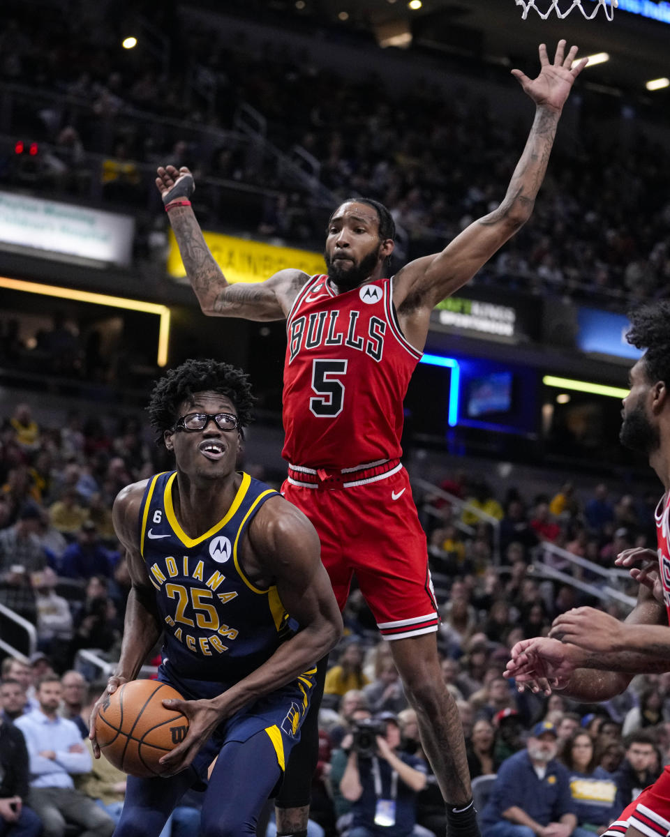 Indiana Pacers forward Jalen Smith (25) looks to shoot in front of Chicago Bulls forward Derrick Jones Jr. (5) during the first half of an NBA basketball game in Indianapolis, Tuesday, Jan. 24, 2023. (AP Photo/Michael Conroy)