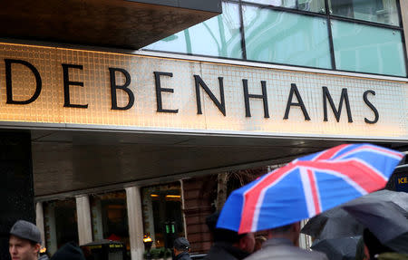 FILE PHOTO: Shoppers walk past Debenhams on Oxford Street in central London, Britain, April 2, 2018. REUTERS/Hannah McKay/File Photo