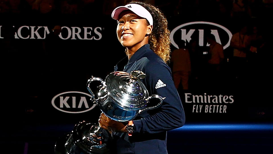 Naomi Osaka is pictured holding the trophy after winning the 2019 Australian Open.