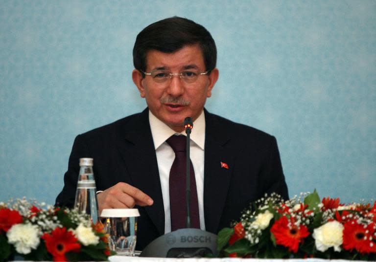 Turkish Prime Minister Ahmet Davutoglu gives a press conference on December 18, 2014 in Ankara