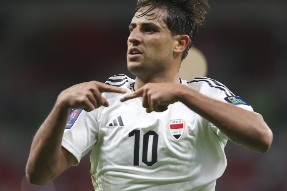 Iraq's Mohanad Ali Kadhim celebrates after scoring his team's first goal during the Asian Cup Group D soccer match between Indonesia and Iraq at Ahmad Bin Ali Stadium in Al Rayyan, Qatar, Monday, Jan. 15, 2024. (AP Photo/Hussein Sayed)