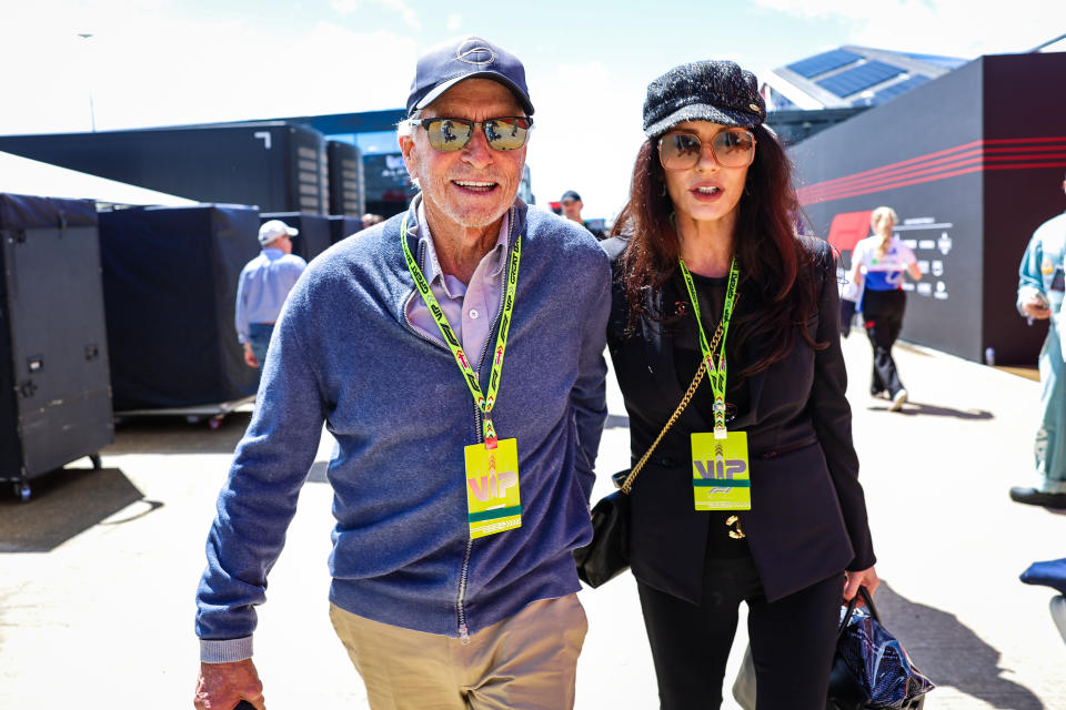 NORTHAMPTON, ENGLAND - JULY 7: Michael Douglas and Catherine Zeta-Jones walk in the paddock during the F1 Grand Prix of Great Britain at Silverstone Circuit on July 7, 2024 in Northampton, United Kingdom. (Photo by Kym Illman/Getty Images)