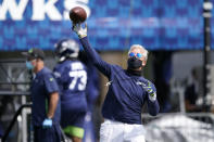 Seattle Seahawks head coach Pete Carroll throws a football during NFL football training camp, Wednesday, Aug. 12, 2020, in Renton, Wash. (AP Photo/Ted S. Warren, Pool)