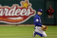 ST LOUIS, MO - OCTOBER 19: Ian Kinsler #5 of the Texas Rangers kneels on the field during Game One of the MLB World Series against the St. Louis Cardinals at Busch Stadium on October 19, 2011 in St Louis, Missouri. (Photo by Rob Carr/Getty Images)