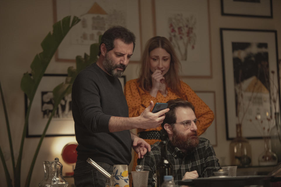 This photo released by Netflix shows characters from the Arabic-language version of the Italian film “Perfect Strangers,” about friends who agree to share their incoming calls, voice and text messages with each other over a dinner party, leading to a series of revelations that test their marriages and friendships. The film’s release has led to a widespread debate in some Arabic-speaking societies, such as Egypt, where some have denounced it as a threat to family and religious values while others praised and defended it.(Rudy Bou Chebel/Netflix via AP)