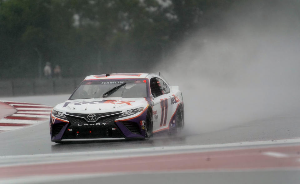 Denny Hamlin (11) drives out of Turn 18 during practice for Sunday's NASCAR Cup Series auto race at the Circuit of the Americas in Austin, Texas, Saturday, May 22, 2021. (AP Photo/Chuck Burton)