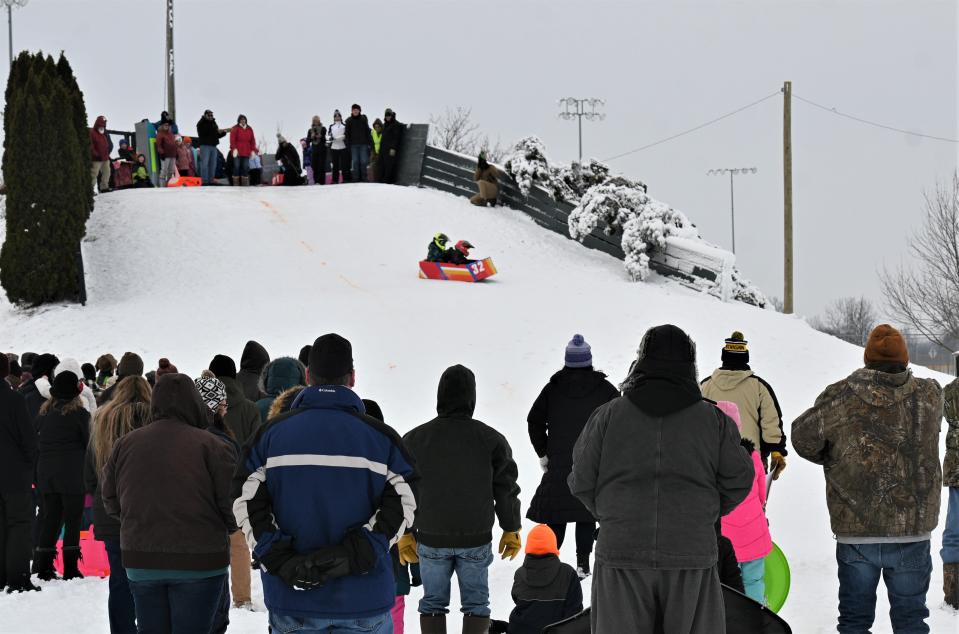 Kids sliding down Kawanis Hill on cardboard sleds was the main attraction at Winterfest Saturday.