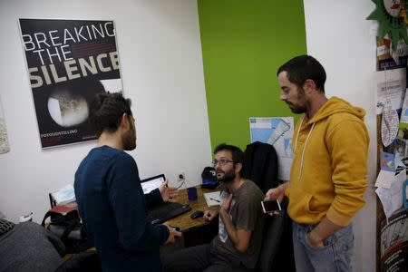 FILE PHOTO: Employees work at the offices of "Breaking the Silence" in Tel Aviv, Israel, December 16, 2015. An ultra-nationalist Israeli group has published a video accusing the heads of four Israel's leading human rights organisations, including "Breaking the Silence", of being "foreign agents" funded by Europe and supporting Palestinians "involved in terrorism". "Breaking the Silence" is an organization that collects anonymous testimony from Israeli soldiers. REUTERS/Baz Ratner/File Photo