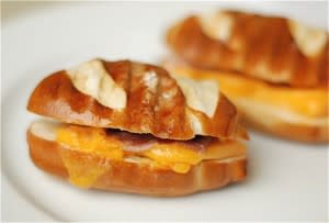 <div class="caption-credit"> Photo by: The Naptime Chef</div><b>Mini Ham & Cheese Pretzel Paninis</b> <br> <b><i>Ingredients:</i></b> <br> Small or large soft pretzels, cut in half <br> Mustard <br> Thinly sliced ham <br> Thinly sliced cheddar cheese <br> <b><i>Directions:</i></b> <br> 1. Slice the pretzels in half and spread a little bit of mustard on one side. <br> 2. Layer in ham and cheese and close the sandwich. <br> 3. Toast on a panini press or stovetop grill pan until the cheese is melted. Slice and serve!