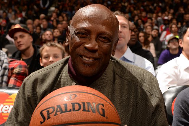 <p>Ron Turenne/NBAE via Getty</p> Louis Gosset Jr. at an NBA game on Nov. 19, 2014