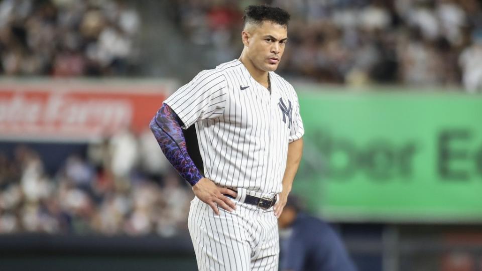 Aug 18, 2023; Bronx, New York, USA; New York Yankees right fielder Giancarlo Stanton (27) stays on the field after an inning ending double play in the sixth inning against the Boston Red Sox at Yankee Stadium.