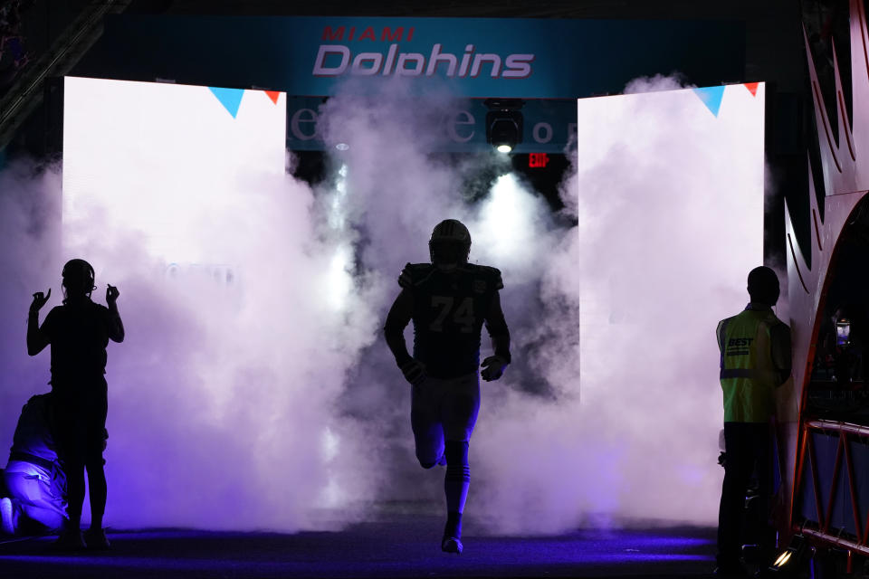 The Miami Dolphins team enters the field before an NFL football game against the Pittsburgh Steelers, Sunday, Oct. 23, 2022, in Miami Gardens, Fla. (AP Photo/Wilfredo Lee )