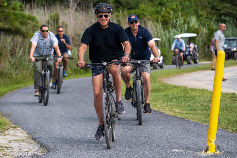 President Joe Biden rides his bike  in Rehoboth Beach (Jim Watson / AFP via Getty Images file)