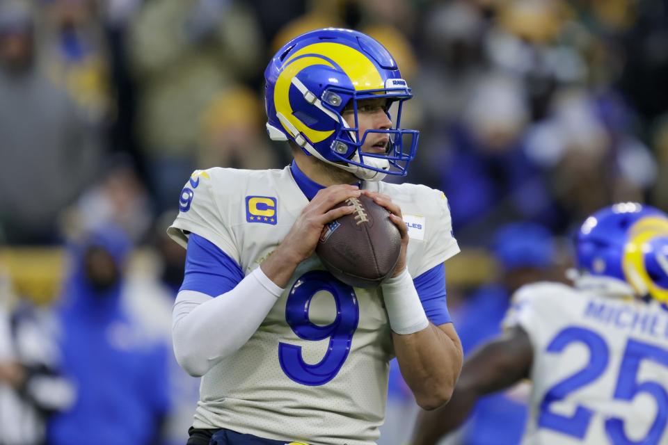 Los Angeles Rams' Matthew Stafford thorws during the first half of an NFL football game against the Green Bay Packers Sunday, Nov. 28, 2021, in Green Bay, Wis. (AP Photo/Matt Ludtke)