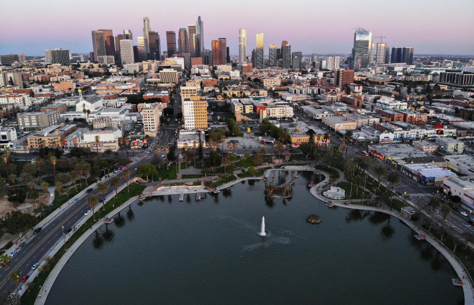 An aerial view shows MacArthur Park and downtown in the midst of the coronavirus pandemic, on April 15, 2020 in Los Angeles, California. Environmental Protection Agency (EPA) data from March shows that Los Angeles had its longest stretch of air quality rated as "good" since 1995 as Safer-at-Home orders were issued in response to the spread of COVID-19. (Photo by Mario Tama/Getty Images)