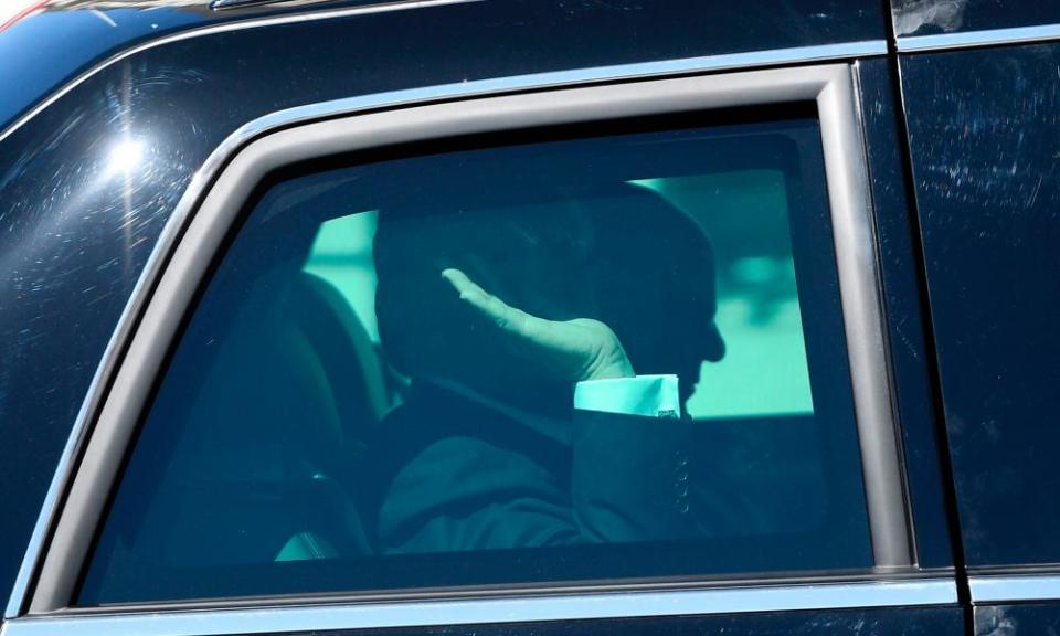 US president Donald Trump waves after leaving the US embassy in Brussels on Thursday.