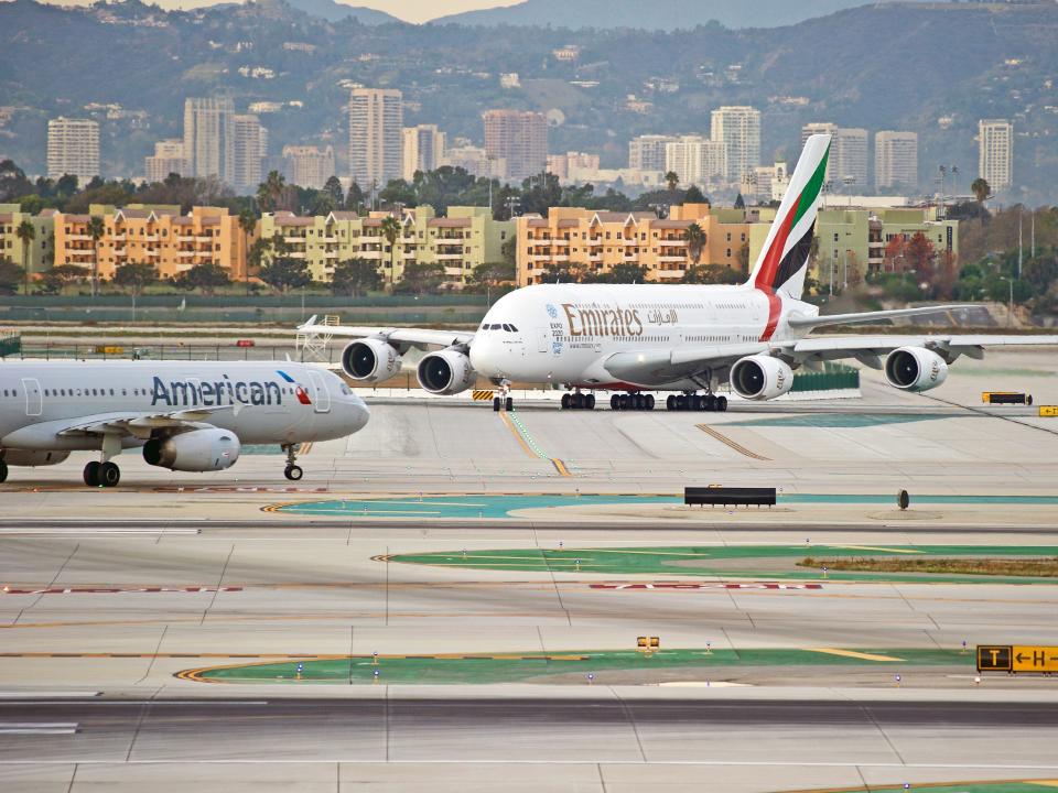 Emirates and American Airlines planes