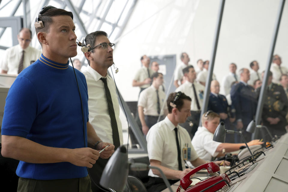 This image released by Apple TV+ shows Channing Tatum, left, and Ray Romano in a scene from "Fly Me to the Moon. (Dan McFadden/Apple TV+ via AP)