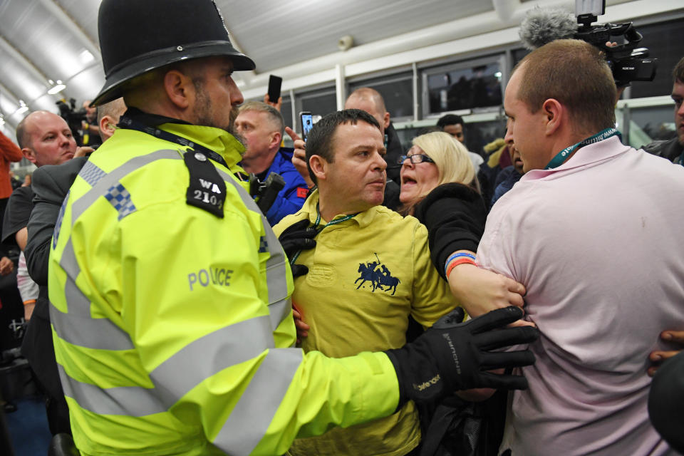 Police with party supporters at the Uxbridge count where Hayes and Harlington MP John McDonnell retained his parliamentary seat after the 2019 General Election, and the result for the Prime Minister's constituency is expected shortly. (Photo by Stefan Rousseau/PA Images via Getty Images)