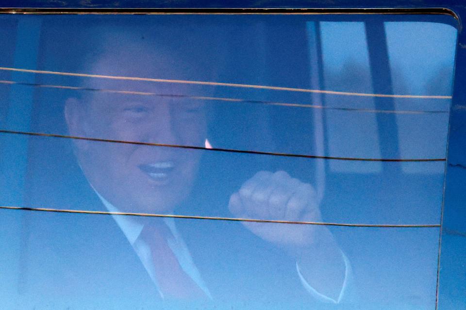 Republican presidential candidate and former President Donald Trump arrives at the courthouse as he is expected to bid for dismissal in a hearing on a classified documents case, in Fort Pierce, Florida on March 14, 2024.