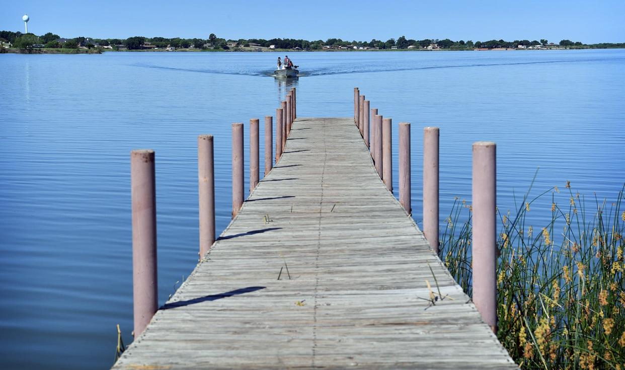In this file photo, a boat approaches the dock at Lake Wichita. Saturday is Free Fishing Day and anglers across Texas can fish on any public body of water without having a fishing license.