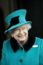 <p>The Queen looks lovely in a teal coat and hat as she visits the new Schroders plc Headquarters in November (Getty) </p>