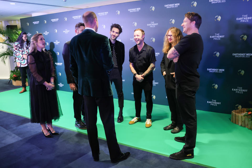 Prince William speaks with the band OneRepublic backstage at the Earthshot Prize Awards