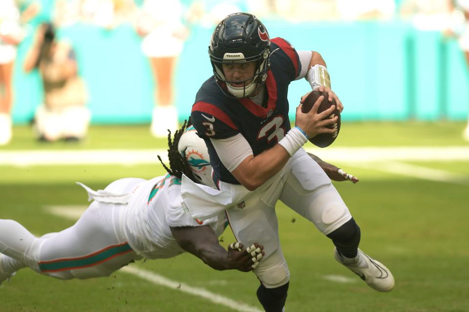 Miami Dolphins linebacker Melvin Ingram (6) sacks Houston Texans quarterback Kyle Allen (3) during the first half of an NFL football game, Sunday, Nov. 27, 2022, in Miami Gardens, Fla. (AP Photo/Michael Laughlin)