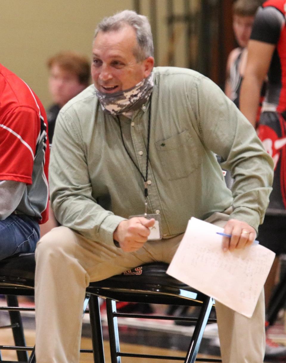 Liberty High wrestling coach Nathan Day died after a bout with COVID in August last year.