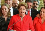 Brazil's Dilma Rousseff is accused of taking illegal state loans to patch budget holes in 2014