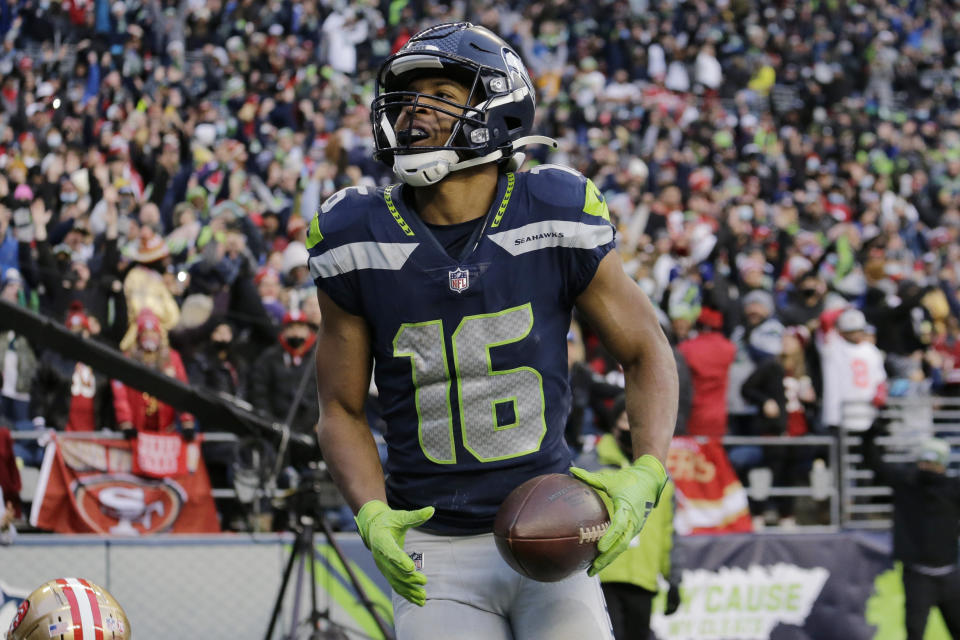 Seattle Seahawks wide receiver Tyler Lockett reacts after he scored a touchdown against the San Francisco 49ers during the second half of an NFL football game, Sunday, Dec. 5, 2021, in Seattle. (AP Photo/John Froschauer)