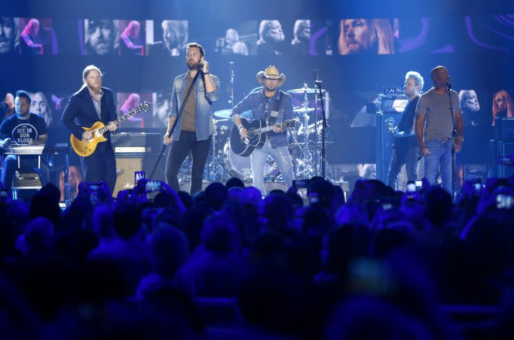 Derek Trucks, foreground from left, Charles Kelley, Jason Aldean, and Darius Rucker perform 