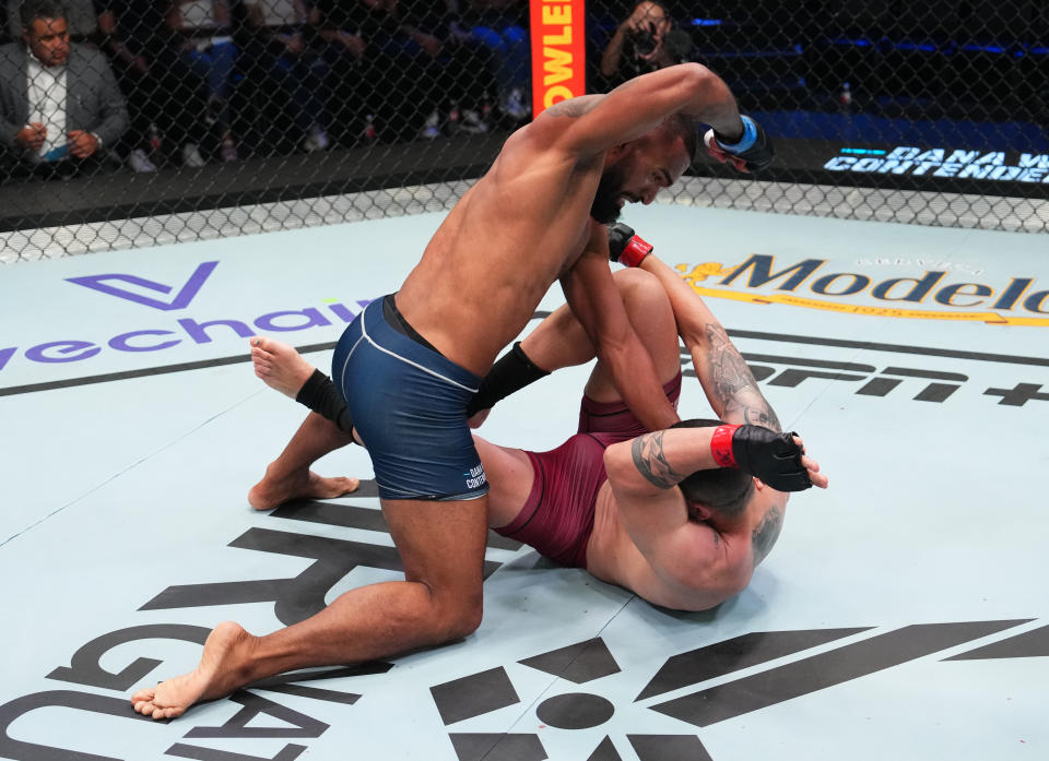 LAS VEGAS, NEVADA – SEPTEMBER 05: (L-R) Brendson Ribeiro of Brazil punches Bruno Lopes of Brazil in a light heavyweight fight during Dana White’s Contender Series season seven, week five at UFC APEX on September 05, 2023 in Las Vegas, Nevada. (Photo by Cooper Neill/Zuffa LLC via Getty Images)