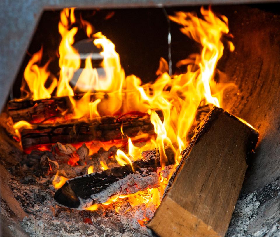 This 2021 file photo shows the kiln-dried oak that Rashad Jones uses in his smokers at Blg Lee's BBQ.