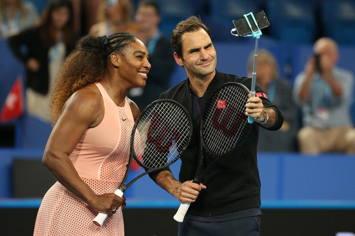 Roger Federer beat Serena Williams in a mixed-doubles exhibition match on Tuesday, but there were no hard feelings when it was over. (Paul Kane/Getty Images)