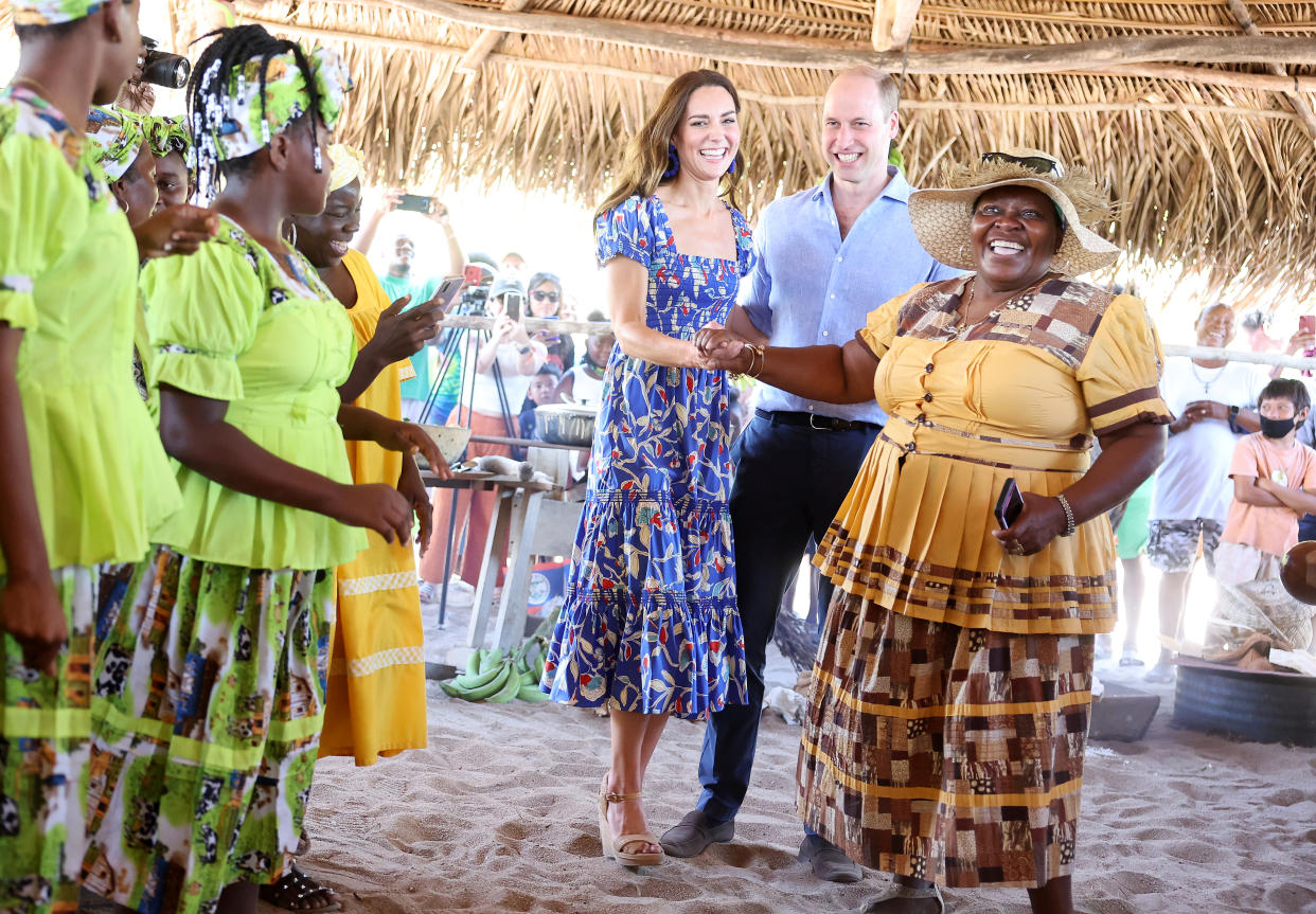 Catherine, Duchess of Cambridge and Prince William, Duke of Cambridge dance during a traditional Garifuna festival in Hopkins, Belize. (Getty Images)